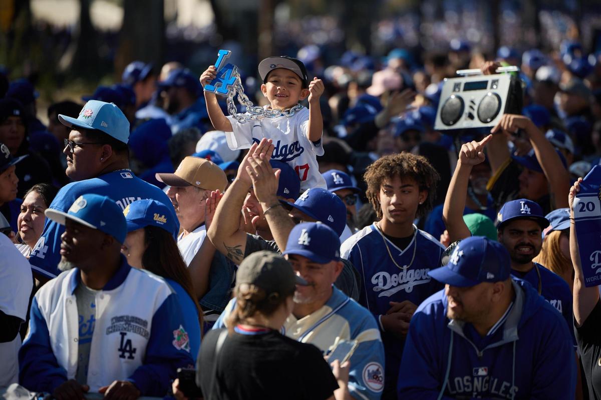 Fans cheer as the Los Angeles Dodgers celebrate their World Series victory with a parade in Los Angeles, California, USA, 01 November 2024.