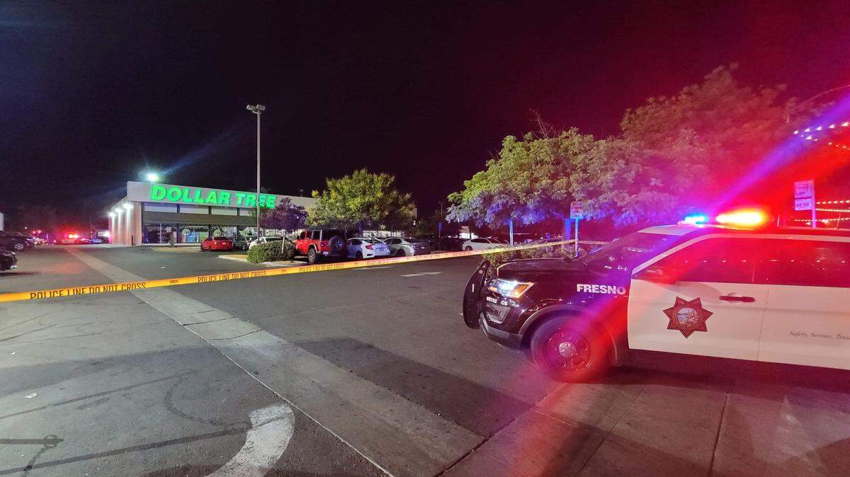 The Fresno Police Department investigate a shooting at the Dollar Tree parking lot in Fresno’s Tower District on Saturday, May 14, 2022.