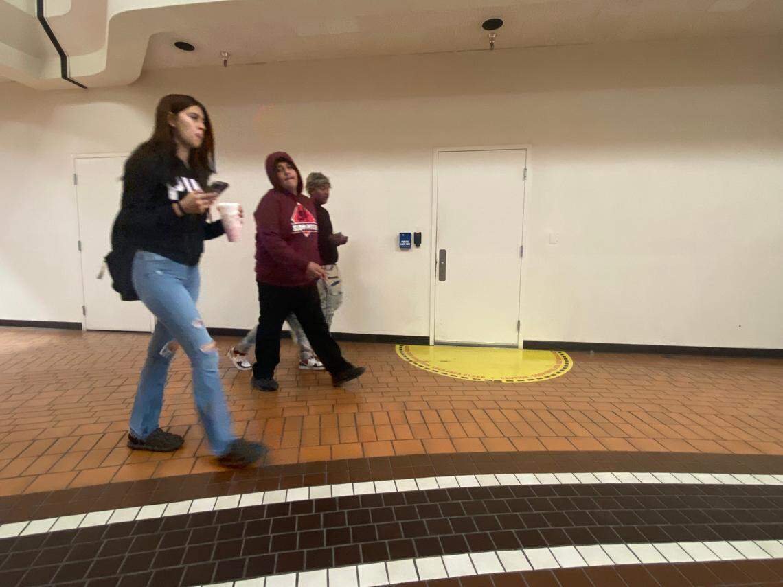 People shuffle pass the DMV call center’s unmarked doorways inside the Manchester Mall in Fresno on Tuesday, Oct. 17, 2023.