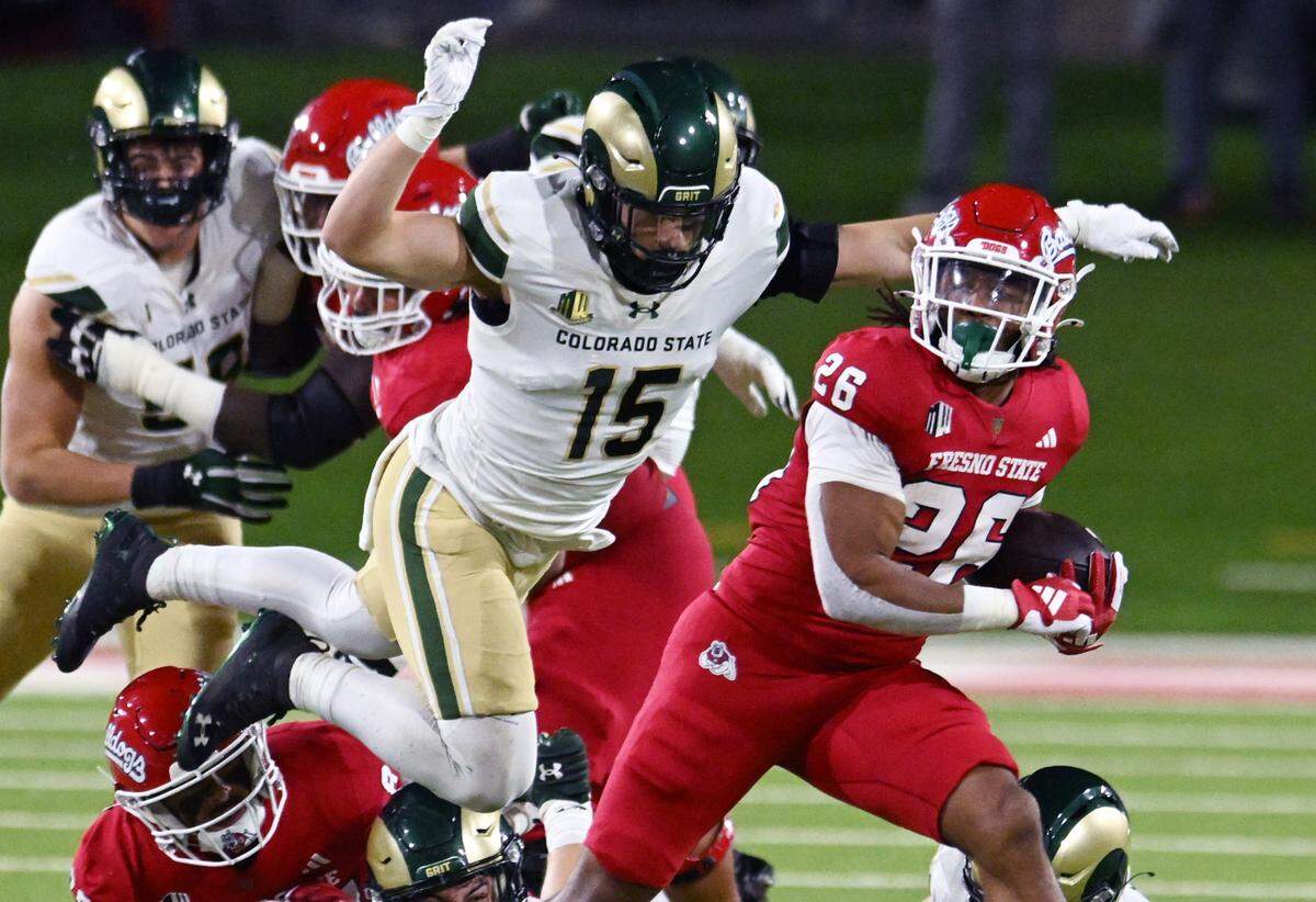 Fresno State’s Bryson Donelson, right, is pursued by Colorado State’s Ayden Hector, left, Saturday, Nov. 23, 2024 in Fresno.