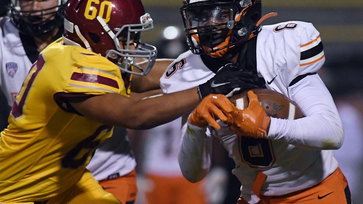 Clovis West’s Kevin Wright II, left, with Central running back Ah’marion Gaines-Smith, right, in a matchup Thursday, Oct 21, 2021 in Clovis. Clovis West pulled ahead to lead 14-13 at halftime.