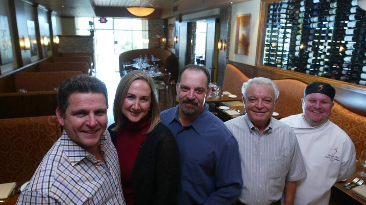 FRESNO, CALIF. -- Left to right Pat LaRocca, wife Marina, brother Paul, father Carmine and executive chef Gerald Sullivan are pictured in this Fresno Bee file photo from 2005. Pat and Marina own Five, the Tuscan/Californian restaurant in Piazza del Fiore at Champlain Drive and Perrin Avenue in north Fresno. LaRocca’s, pictured here in its 26th year was owned at the time by by Paul LaRocca, Pat’s brother, and Carmine the father.