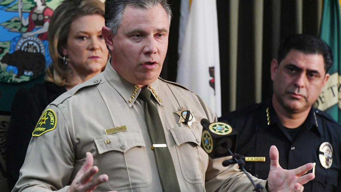 Fresno County Sheriff John Zanoni, with Fresno County District Attorney Lisa Smittcamp to the left in the background, and Selma Police Chief Rudy Alcaraz to the right, announces an update on the killing of Selma police officer Gonzalo Carrasco Jr. at a press conference Friday, Feb 3, 2023 in Fresno.