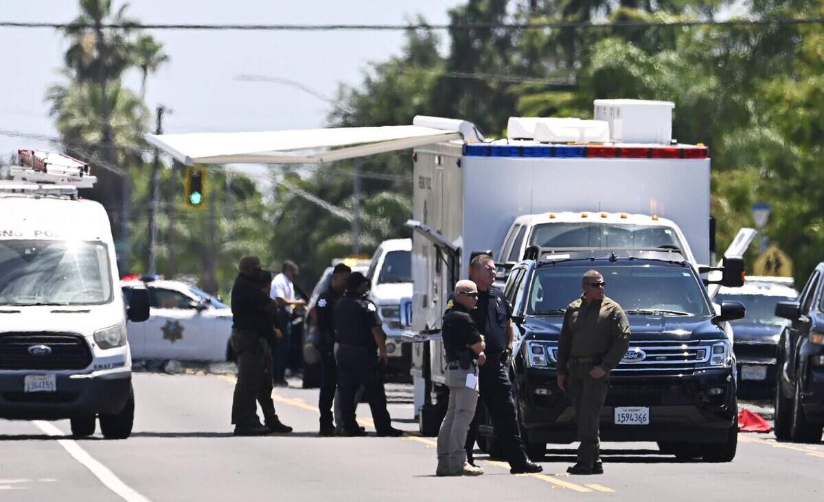 Law enforcement are seen at the location of an officer involved shooting on Cedar and Eugenia avenues south of Church Avenue Friday afternoon, June 5, 2026 in Fresno.