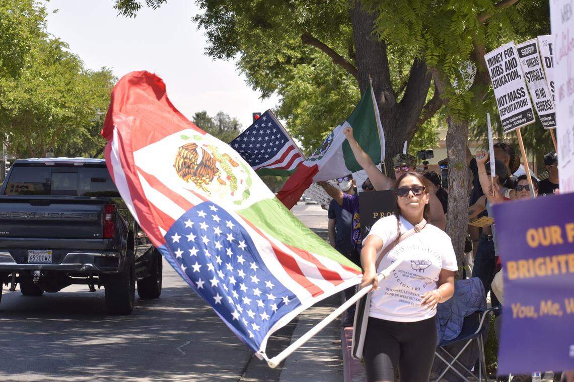 Anti-ICE protestors line the Tulare Street sidewalk outside the Robert E. Coyle federal courthouse in downtown Fresno on Monday.