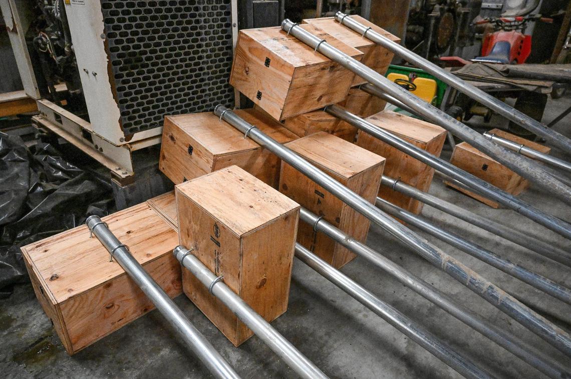 A few of the owl boxes and poles from The Owl Box Company in Madera await to be placed on farms. The boxes are made to attract barn owls which keep the rodent populations down.