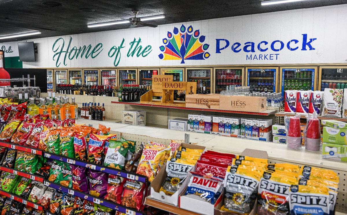 Snacks and beverages are displayed in Peacock Market which now has Peacock Artisan Eatery with local restaurants selling sandwiches, tacos and coffee.
