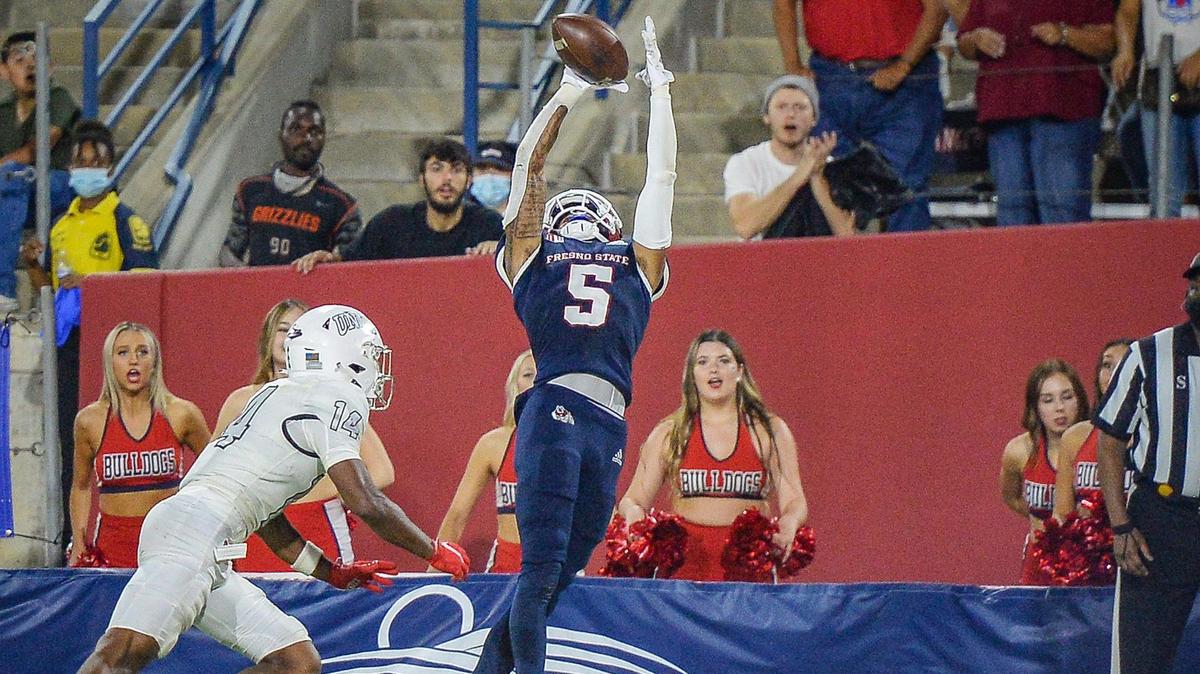 Fresno State’s Jalen Cropper leaps for a touchdown catch as UNLV’s Tyson Player defends on the play during their game at Bulldog Stadium on Friday, Sept. 24, 2021.