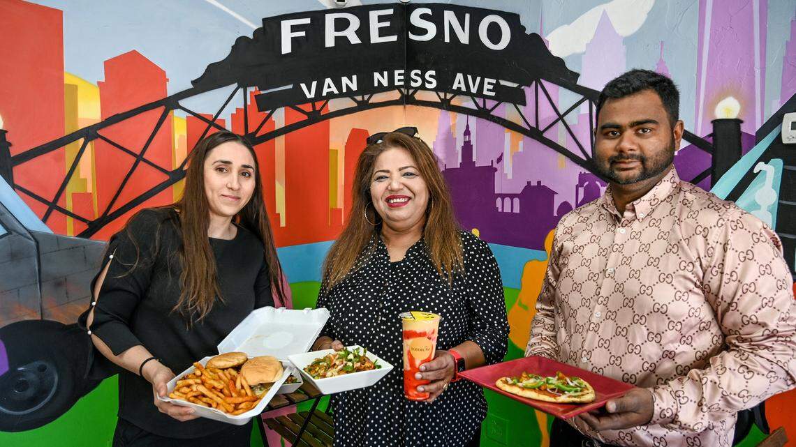 Kamal Kaur, center, of Bubble Bee and The Curry Life is pictured in this file photo from 2023 with partners of another business, Lily Khachatryan, left, of Spicy Birdz, and Kaur’s colleague Smit Shah in the space they share at Herndon and West in Fresno. Separately, Kaur and her husband are opening The Yellow Chilli restaurant in Fresno.