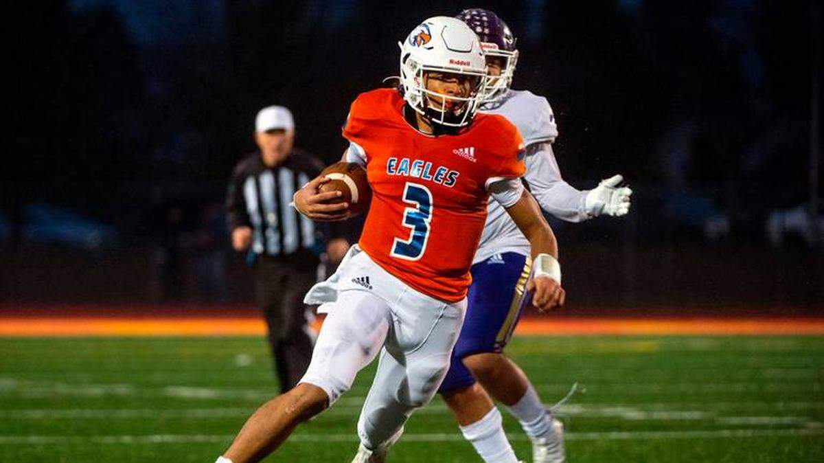 Graham Kapowsin quarterback Joshua Wood (3) scrambles out of the pocket during the second quarter of the State 4A championship game against Lake Stevens on Saturday afternoon at Mount Tahoma Stadium in Tacoma. Wood has committed to Fresno State.