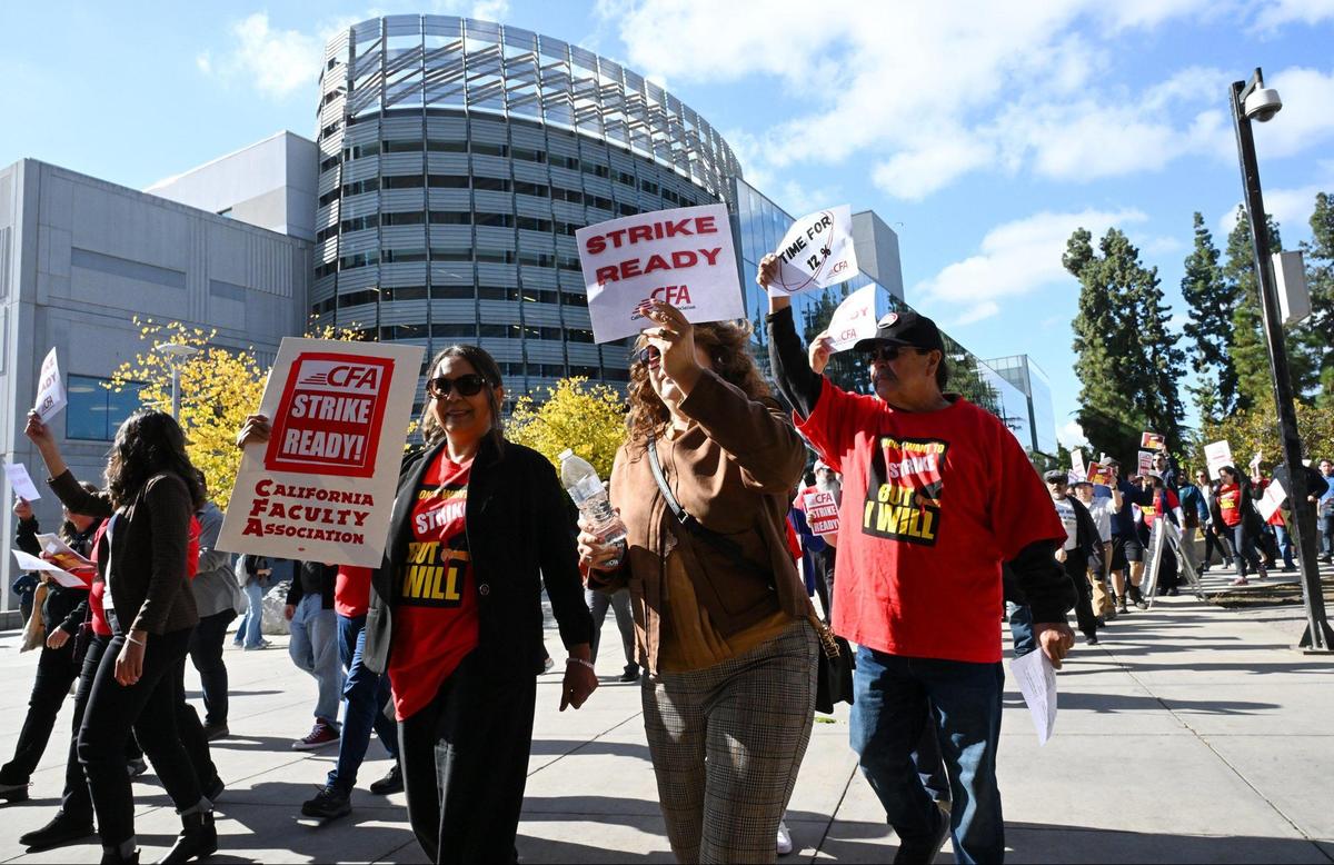 Hundreds marched through the Fresno State campus as the Fresno Chapter of the California Faculty Association held a rally calling attention and support for contract negotiations Tuesday morning, Nov. 7, 2023 in Fresno.