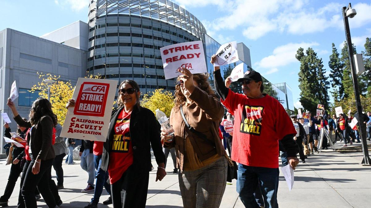 Hundreds marched through the Fresno State campus as the Fresno Chapter of the California Faculty Association held a rally calling attention and support for contract negotiations Tuesday morning, Nov. 7, 2023 in Fresno.