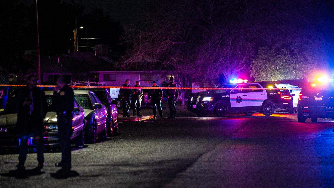 Police investigate a shooting that sent four people to the hospital in the area of Normal Avenue and Mayfair Drive in central Fresno on Monday, Dec. 13, 2021.