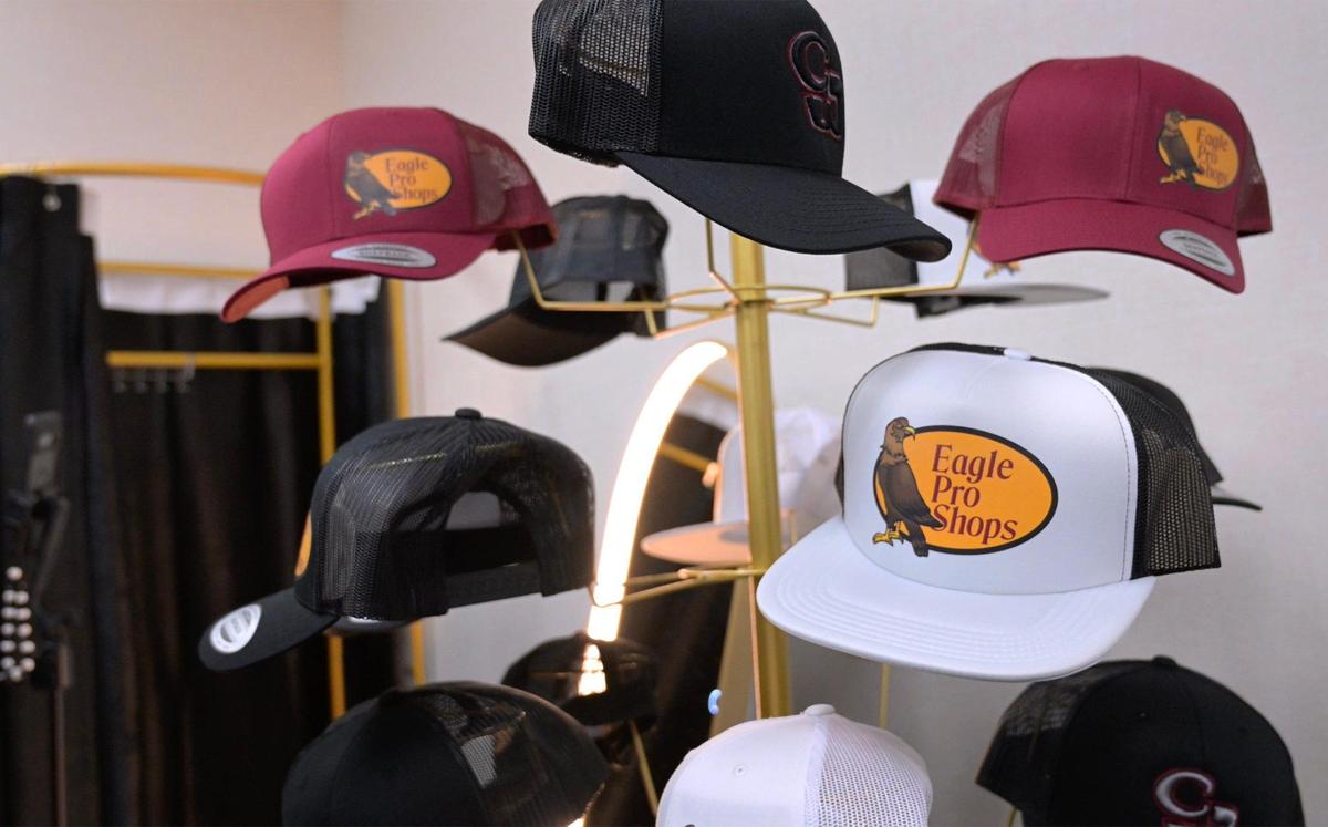 Hats emblazoned with the school’s logo are seen available at Clovis West’s new student store Golden Eagle Outfitters, Thursday afternoon, Jan. 30, 2025 in Fresno. The store receives donated new and almost-new clothing for students, inspired by a past student’s need.