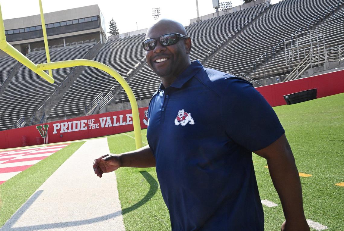 Tim Skipper, right, arrives for his first appearance with the media as Fresno State’s interim head football coach at Valley Children’s Stadium Wednesday morning, July 24, 2024 in Fresno.