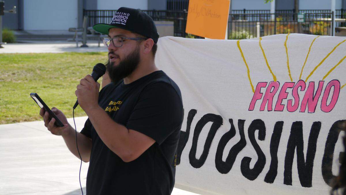 Ruben Espinoza, a policy advocate with Fresno Barrios Unidos, speaks at the State of the People of the City event in downtown Fresno’s Cultural Arts Park on May 19, 2022.