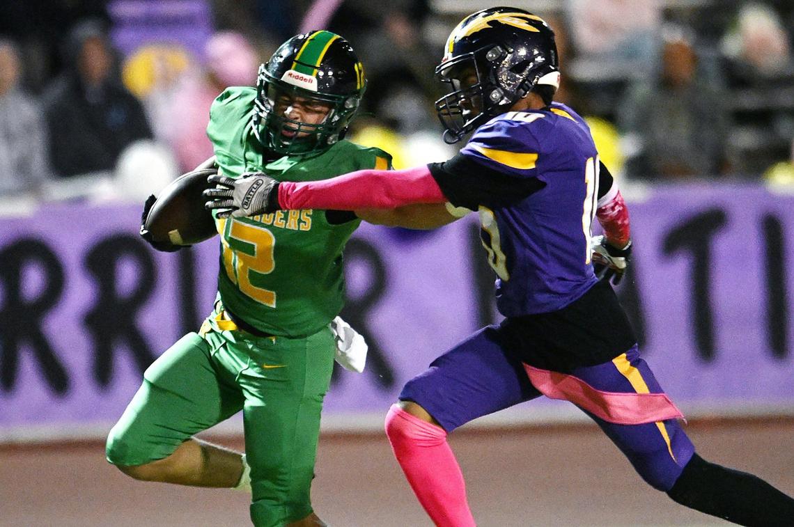 Roosevelt’s Dominick Gonzalez, left, fights off Fresno’s Synceer Guillory, right, as he runs the ball in for a touchdown Friday, Nov. 1, 2024 in Fresno. Roosevelt went on to beat Fresno 54-12.