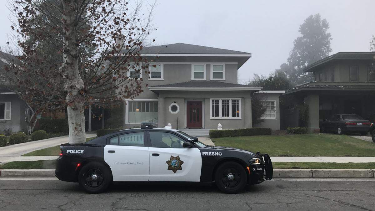 Police investigate the reported theft of two cars from a Tower District home near Fresno City College on Thursday, Jan. 2, 2020.