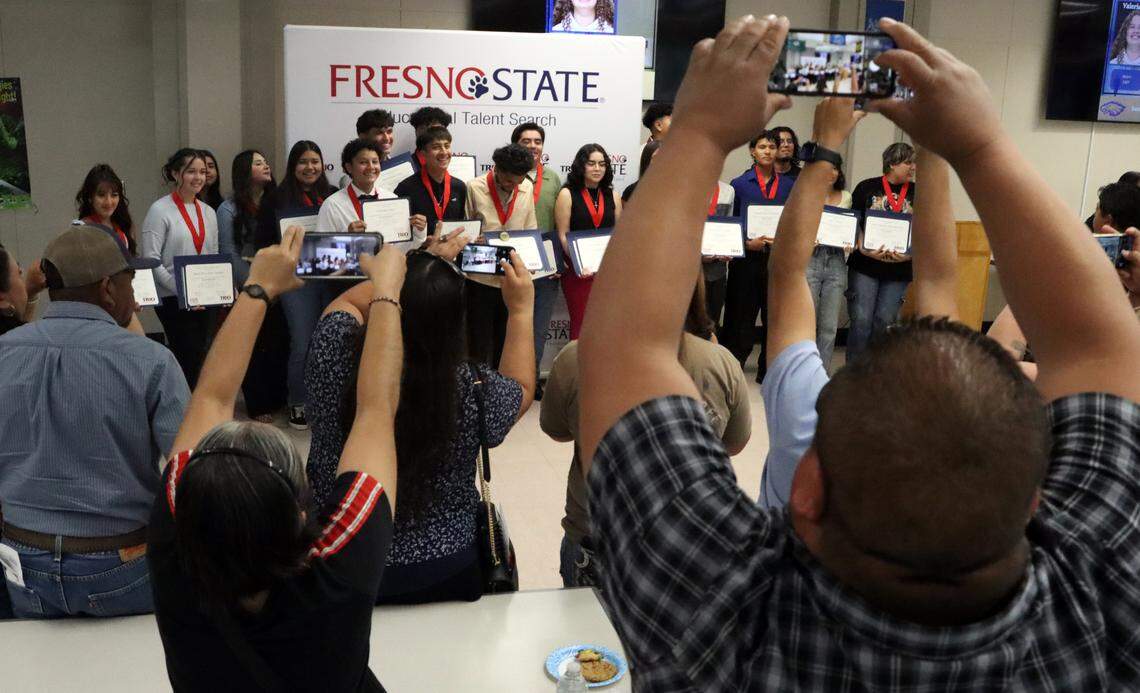 Family and friends of the 23 Riverdale High TRIO graduates take a group photo following a May 14, 2025 ceremony.