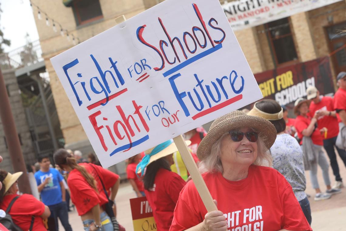 Central Valley educators, families, students and supporters demand U.S. Rep. David Valadao to defend funding for valley schools and urge the Republican congressman to oppose federal cuts to public education on May 17 in Hanford CA.