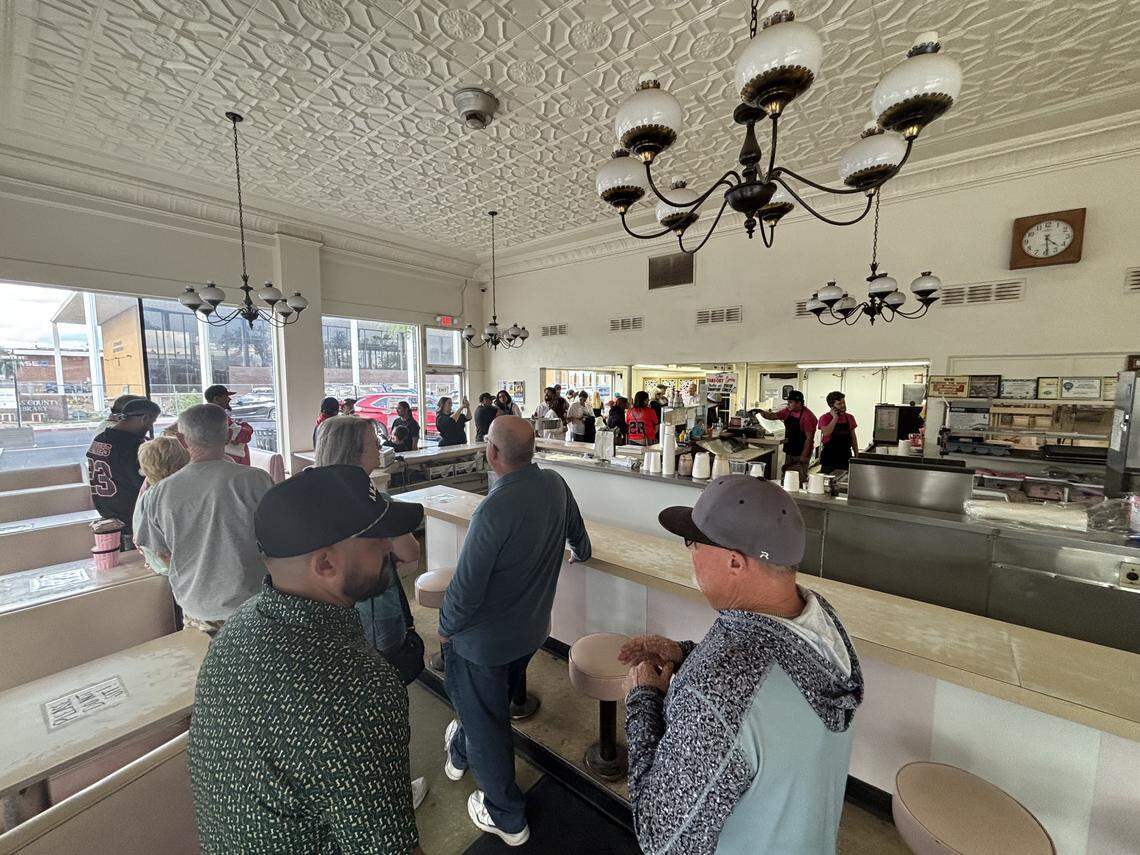 Loyal customers crowed the beloved business on its last open day for a chance to step foot inside the building one more time, get their favorite massive scoops treats, take photos of the nostalgic famous pink booths and pink stools or take home copies of the old Superior Dairy menus as souvenirs before renovations on April 12, 2026.