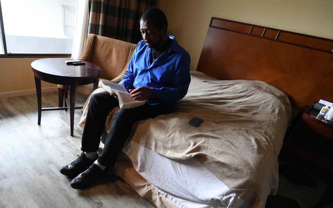 Crossroads Village resident Lloyd Spaulding, 69, reads his Bible in the solitude of his room, March 19, 2021. He became homeless in 2016, living on benches, in friend’s homes, “It was hard, I lost my clothes, lost everything”. “Since I got here, I love it, its quiet, its peaceful, and I can pray.” I know that I’m going to make it…I feel good about myself…this is going to get me on my feet, so I can go further and do other things.” Addressing the needs of Fresno’s homeless population, the grand opening of the newly renovated Crossroads Village, the former Smugglers Inn, built in 1972, was held March 19, 2021 by the County of Fresno and developers RH Community Builders and UPholdings.
