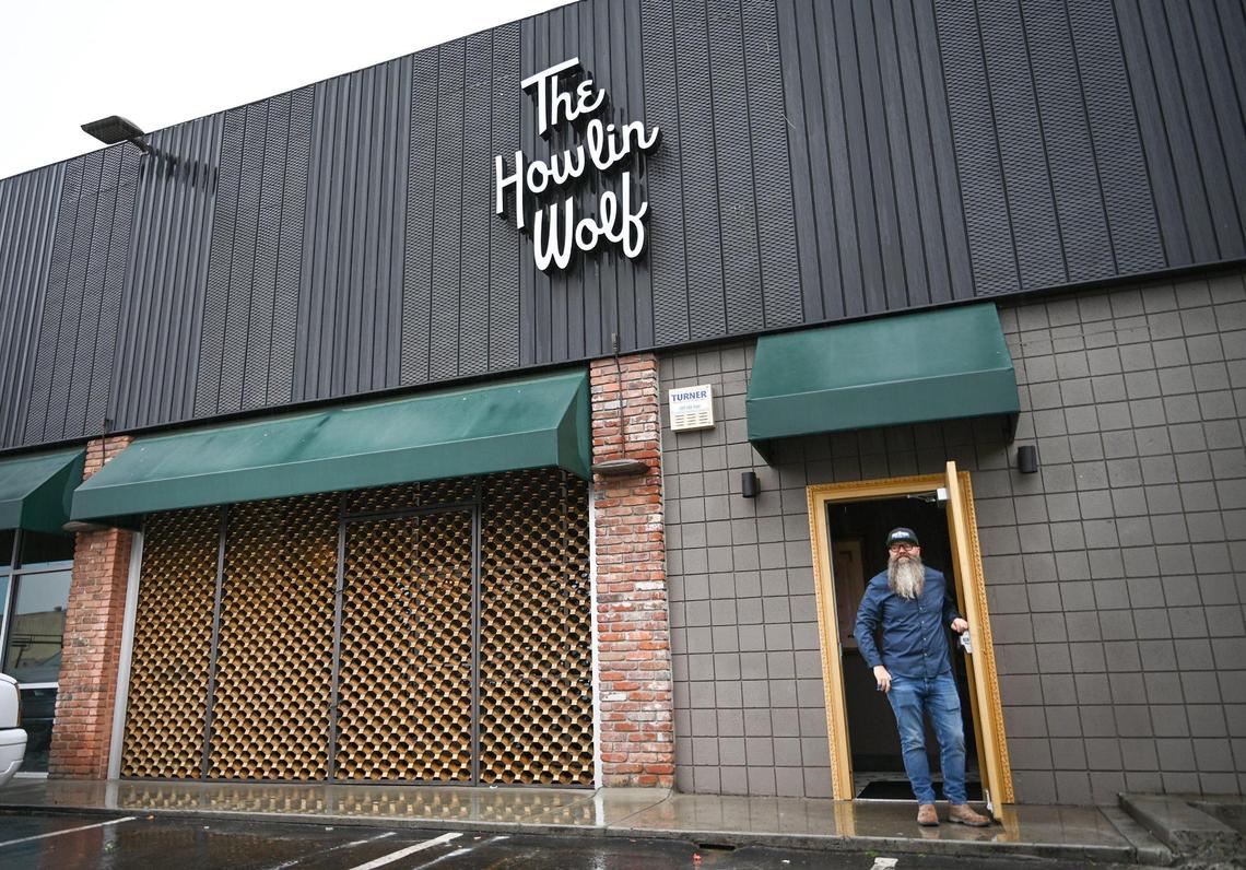 Craig Johnson, majority owner of The Howlin Wolf cocktail bar in the Tower District of Fresno stands outside the new bar on Tuesday, Dec. 14, 2021. The front facade features some of the metal work from the exterior of the old Proctor’s Jewelers in downtown.