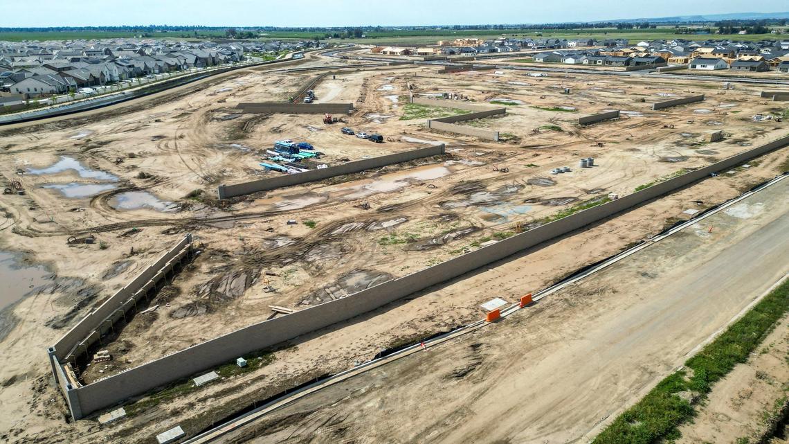 The beginnings of home construction is shown in this drone image in the Heritage Grove area near the Dry Creek trailhead in Clovis on Wednesday, April 17, 2024. The roads in that area have been closed since Jan. 1 for road widening and underground utilities work related to housing construction in the Heritage Grove growth area. Now city officials say it won’t reopen until the end of June.