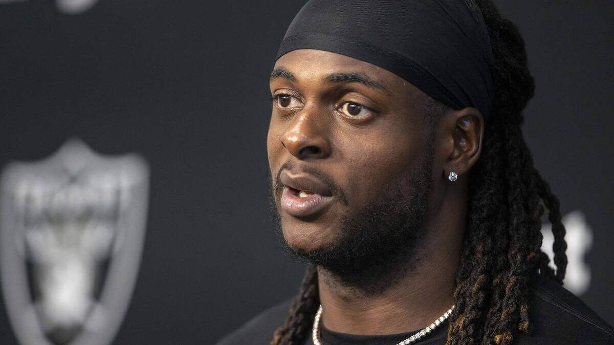Raiders wide receiver Davante Adams responds to questions at a news conference following the team’s training camp practice at the Intermountain Healthcare Performance Center on Sunday, July 24, 2022, in Henderson, Nevada.