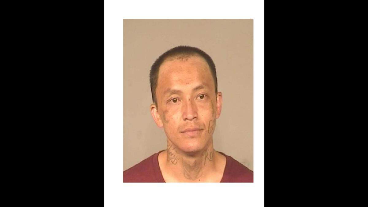 Lue Vang, 30, of Fresno faces a murder charge in the stabbing death of Thavone Phaysamone, 43, of Fresno.