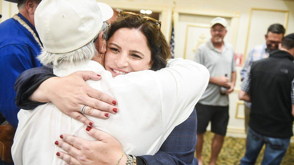 Nicole Silveira hugs a supporter as she takes an early lead in the Merced County District Attorney’s race.