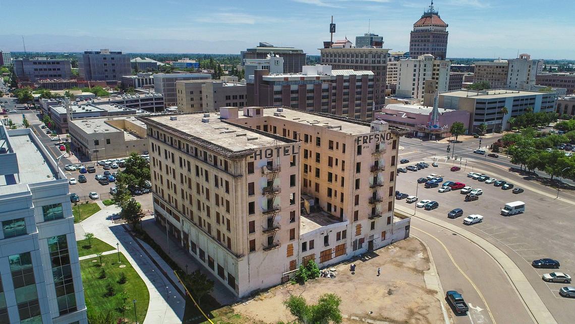 The Hotel Fresno, which has been vacant for over 35 years sits in the downtown area at Broadway Plaza as seen in this drone image on Tuesday, July 2, 2019. A Los Angeles developer has purchased the building and will soon begin construction on affordable housing units while preserving the hotel’s historic aspects.