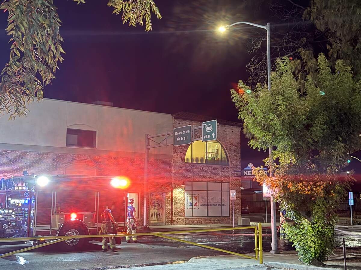 A roof at Kepler School in downtown Fresno caught on fire after embers from a tree caught on fire because of illegal fireworks on Sunday, July 5, 2026.