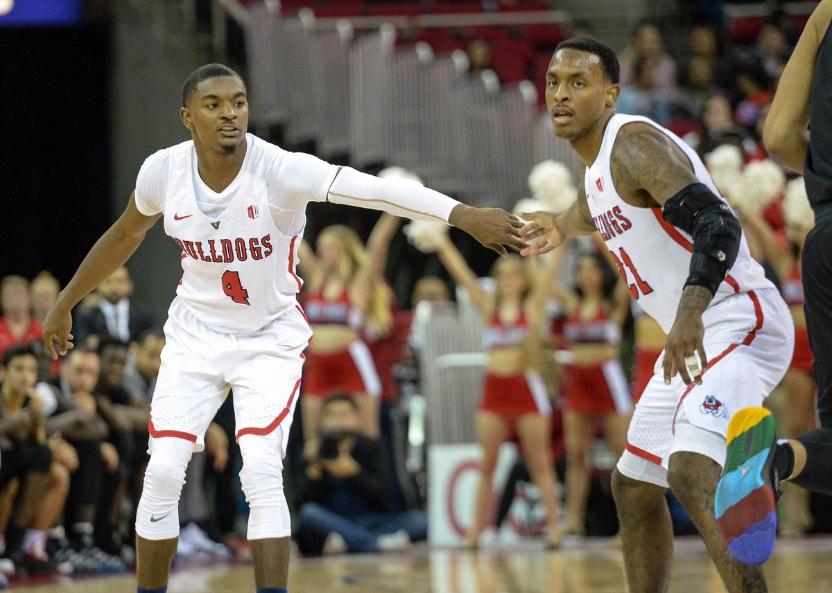 Fresno State’s Braxton Huggins, left, gets some encouragement from teammate Deshon Taylor while the Bulldogs mounted a comeback against San Diego State at the Save Mart Center on Tuesday, Jan. 22, 2019.