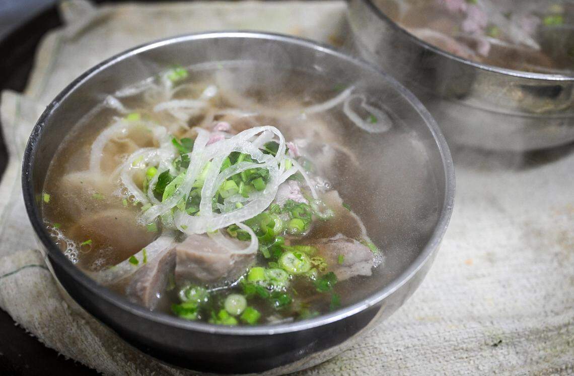 A steaming bowl of pho awaits customers at Nho Kitchen in the Mayfair Center at First and McKinley in Fresno on Tuesday, Dec. 2, 2025.