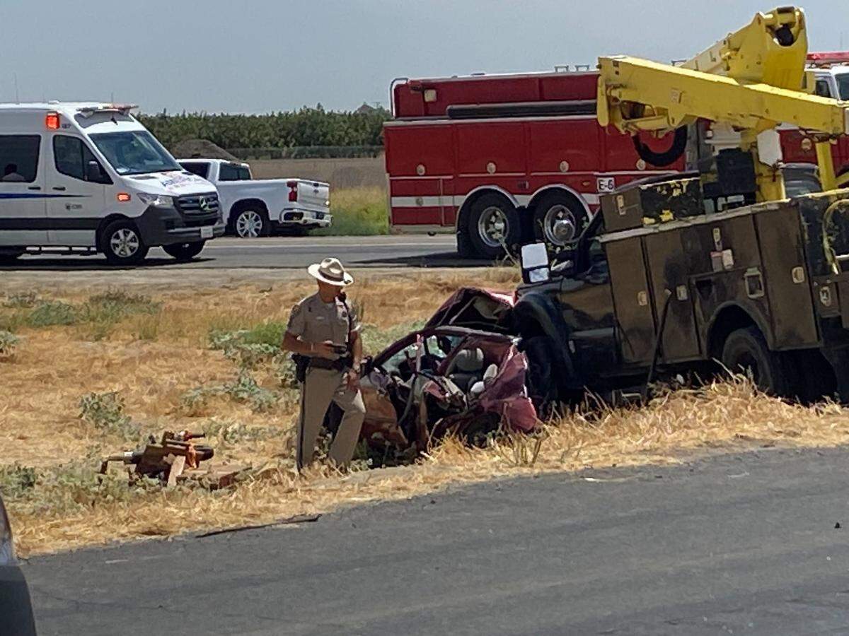 A California Highway Patrol officer investigates a fatal collision on Highway 41 after a heavy-duty Ford pickup slammed into a Toyota on northbound Highway 41 Monday afternoon.