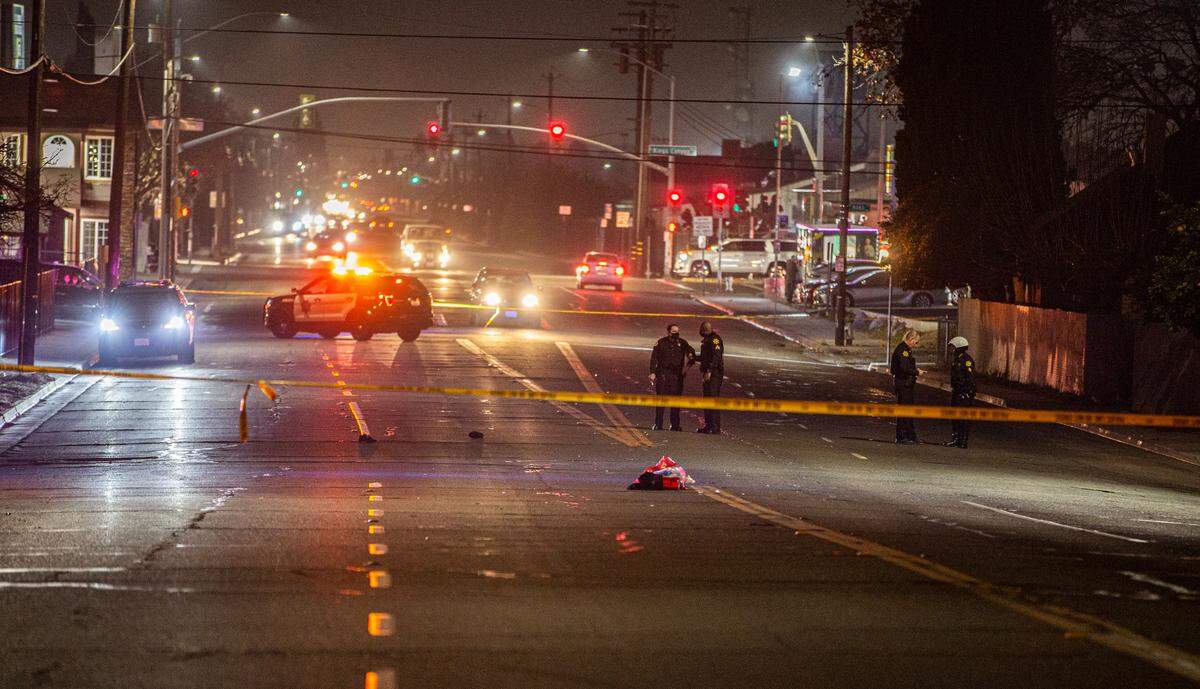 Fresno police investigate the scene after a woman and a man were hit by a car that then left the area near Maple and Inyo Avenues in southeast Fresno on Friday, Jan. 15, 2021. .