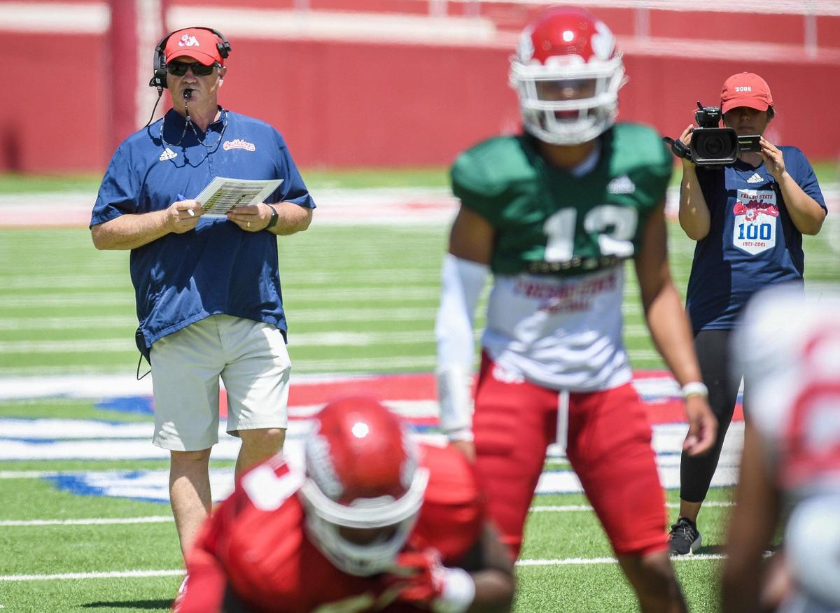 Fresno State coach Jeff Tedford keeps an eye on the offense during the Bulldogs’ spring preview event Saturday, April 30, 2022, at Bulldog Stadium.
