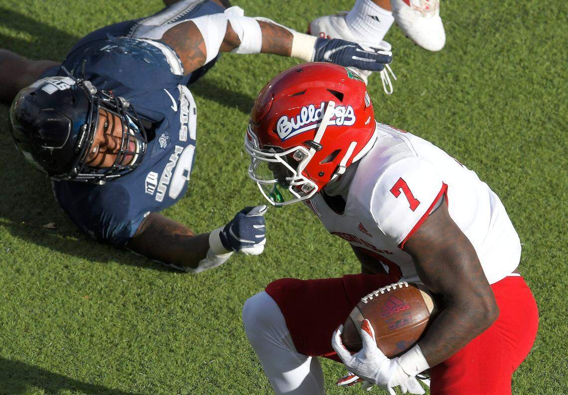 Fresno State running back Jordan Mims (7) runs past Utah State linebacker Kevin Meitzenheimer during the second half of an NCAA college football game, Saturday, Nov. 14, 2020, in Logan, Utah. (Eli Lucero/Herald Journal via AP, Pool)