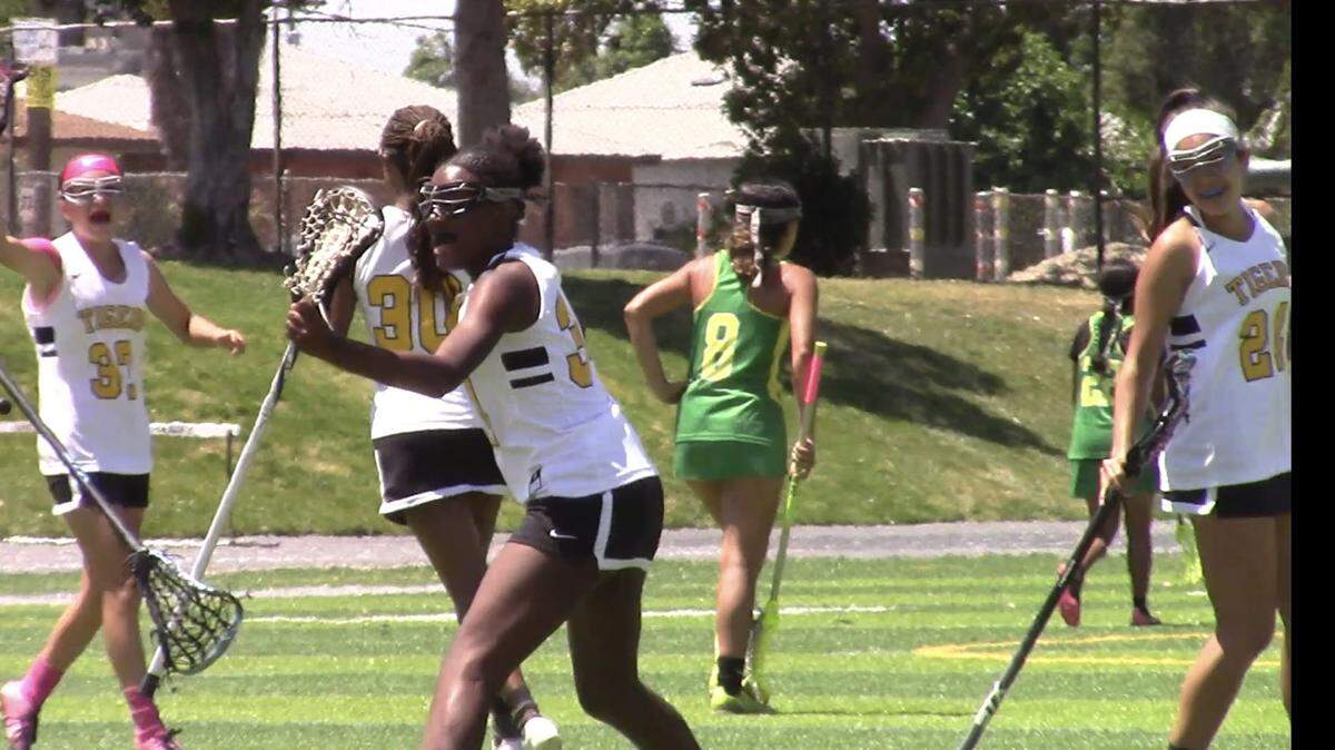 Edison’s Kaiya Alexander, middle, celebrates a goal in the championship game against Roosevelt on Saturday, May 7, 2022.