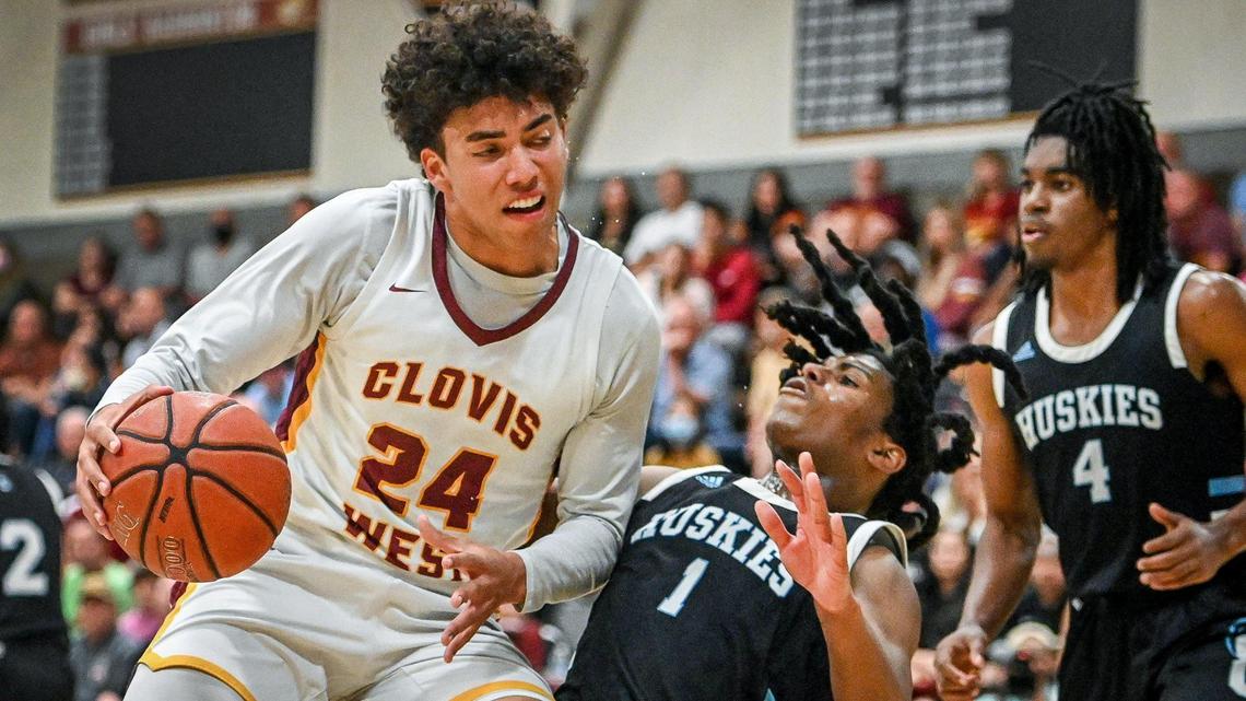 Clovis West’s Tyus Parrish-tillman, left, collides with Sheldon’sDonovan Morgan while making a move to the hoop during their CIF NorCal Open Division state playoff basketball game at Clovis West on Wednesday, March 2, 2022.