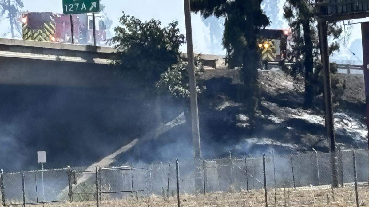A grass fire was ignited on Saturday near Highway 41, at the O Street offramp in Fresno, California on Saturday, May 16, 2026.