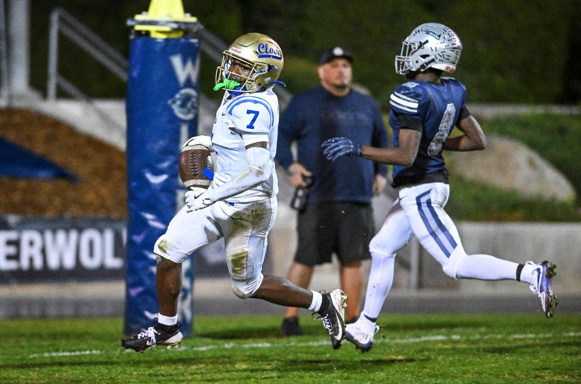 Clovis’ Dezjour Malone, left, runs into the end zone ahead of Clovis East’s Tyrone Bishop for a touchdown reception during their Central Section Division 1-AA semifinal game at Lamonica Stadium in Clovis on Friday, Nov. 15, 2024.