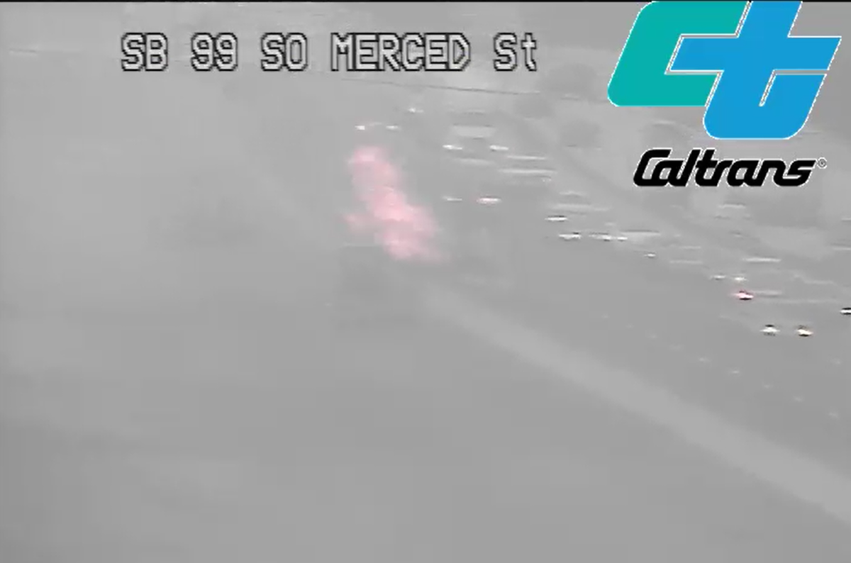 A vehicle caught on fire on Highway 99, south of Fresno on Thursday, Aug. 4, 2022.