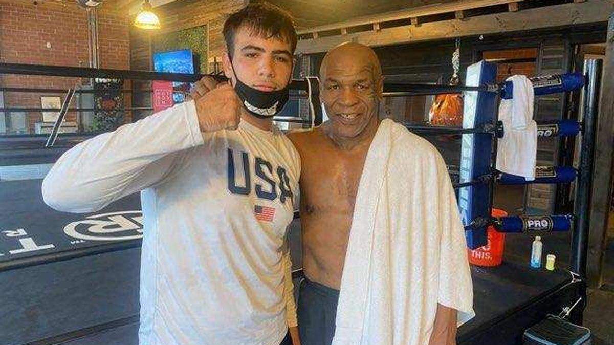 Jett Blackwell of Fresno poses with former undisputed world heavyweight champion Mike Tyson in El Segundo. Blackwell spent a month sparring with Tyson.