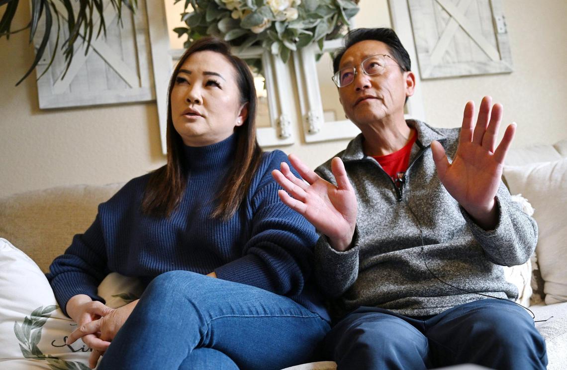 Fresno City Council candidate Brandon Vang, right, with his wife May Lee, left, talk about the negative attack mailer he and others have received which he said points to “dark money” in an interview Wednesday, March 12, 2025 in Fresno.