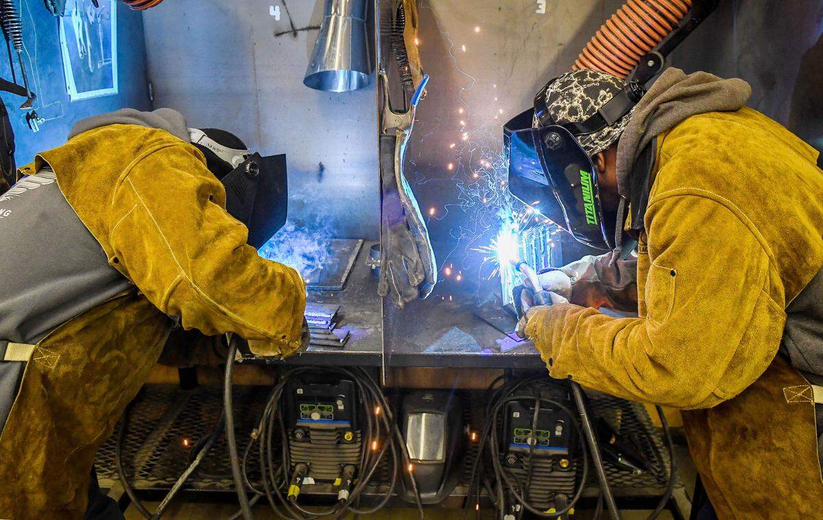 Pierre Cruz, left, works alongside Pierre Matthews in the Gladiator Welding Program held at Washington Union High School on Monday, Dec. 6, 2021.