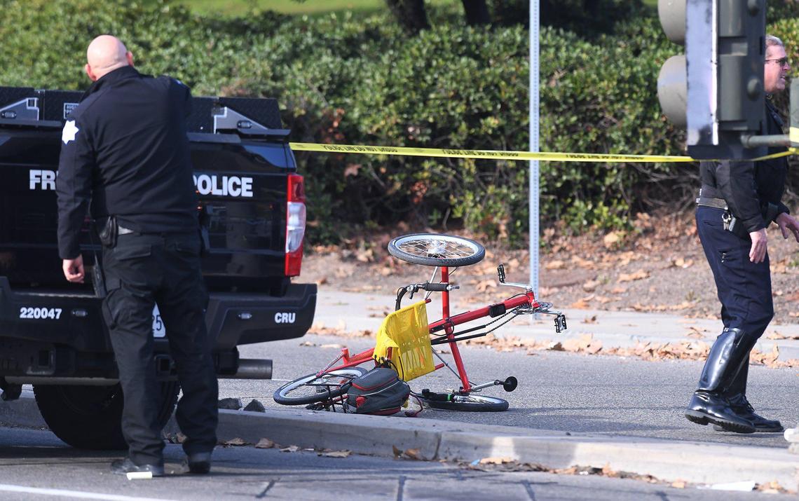 Police investigate the scene where a man in his 50s riding a bicycle was killed after being struck by a pickup truck at Friant Avenue and Audubon Drive next to Woodward Park Wednesday afternoon, Jan.12, 2022 in Fresno.