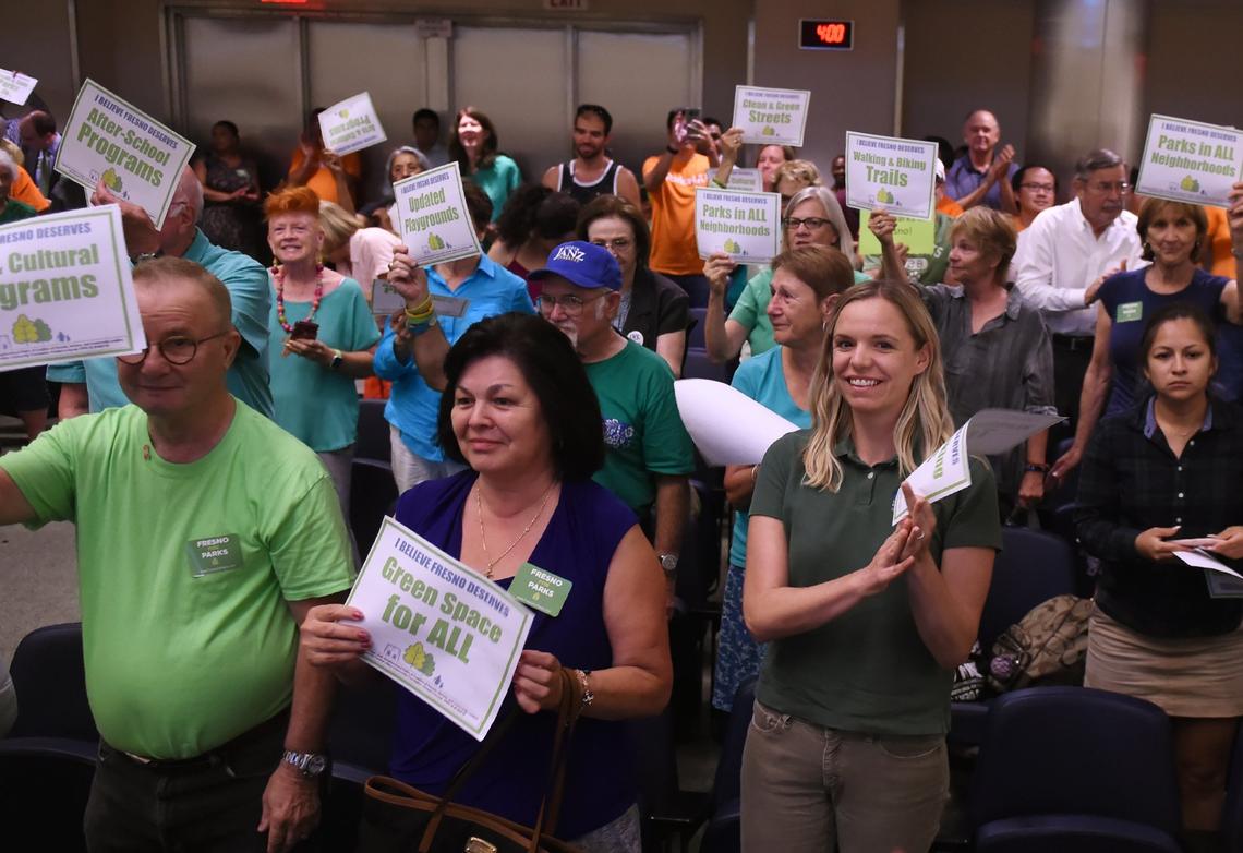 Measure P proponents stand up in support of the parks tax as the Fresno City Council voted to place the citizen-driven initiative on the November ballot during an August 2018 council meeting.