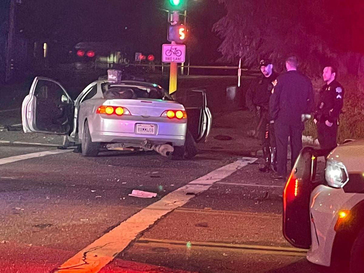 Officers investigate a scene near Wishon and Clinton avenues on Sunday, March 6, 2023, after a man fled police and crashed into others, causing injuries, Fresno police said.